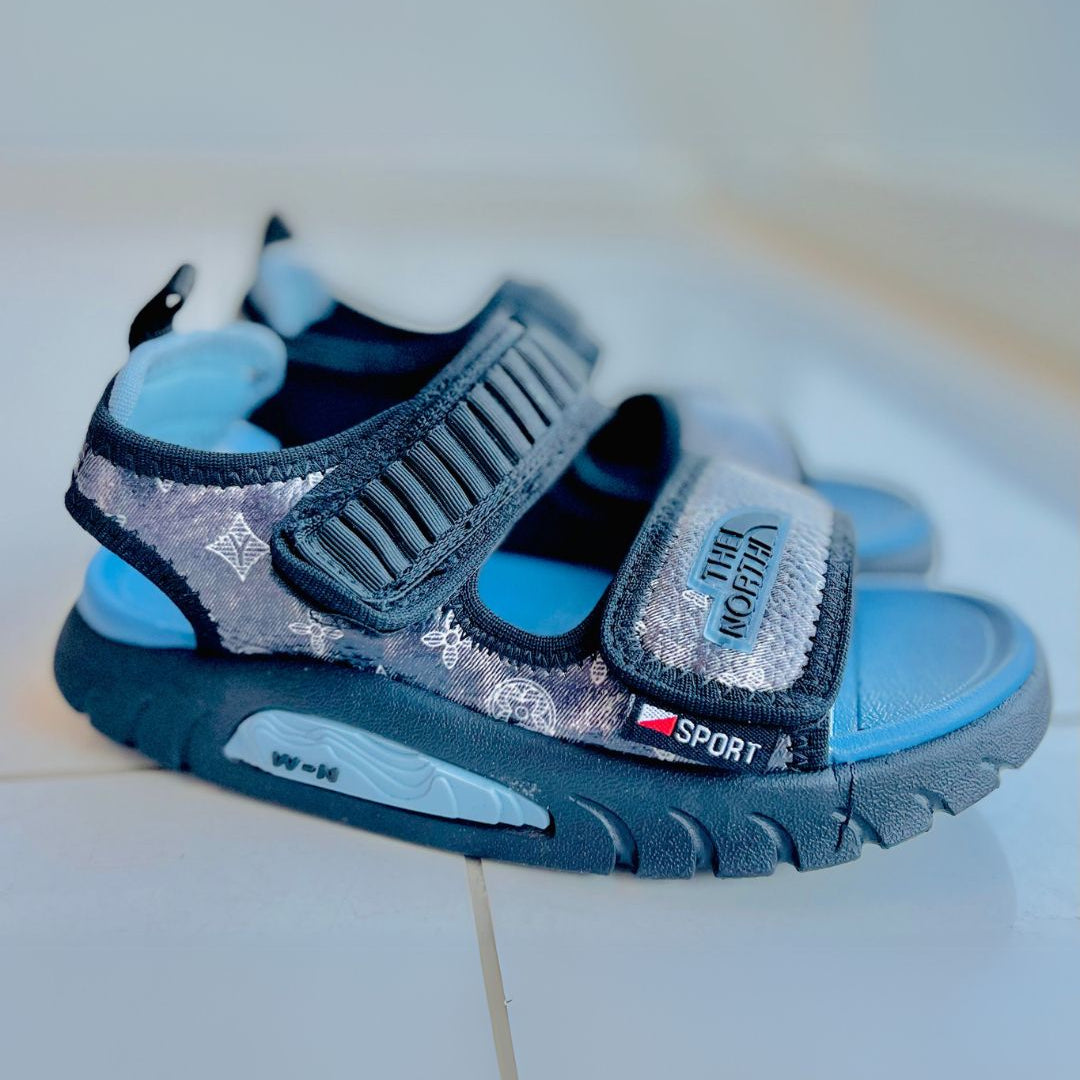 Blue and gray sandals with a visible brand logo on a white background