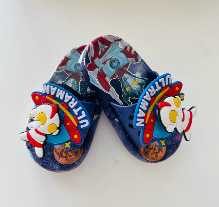 Pair of blue sandals with Ultraman design on a white background