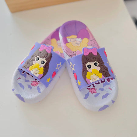 Pair of children's slippers with cartoon character design on a light background