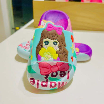 Colorful children's sandals with a cartoon character design on a white surface.