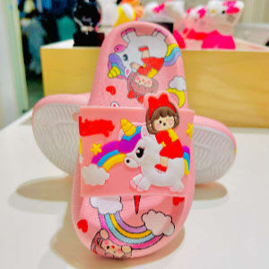 Pink children's shoes with cartoon designs on a white surface.