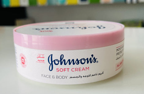 Johnson's Soft Cream jar on a white surface with a colorful background