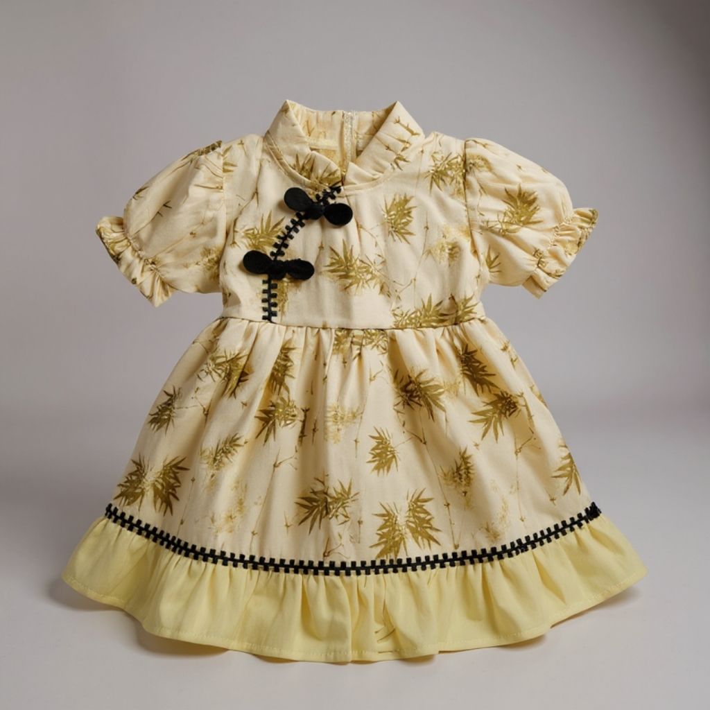 Yellow dress with leaf pattern and black accents