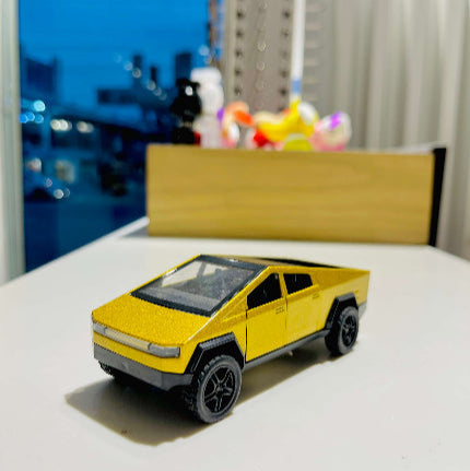 Yellow toy truck on a surface with a blurred background