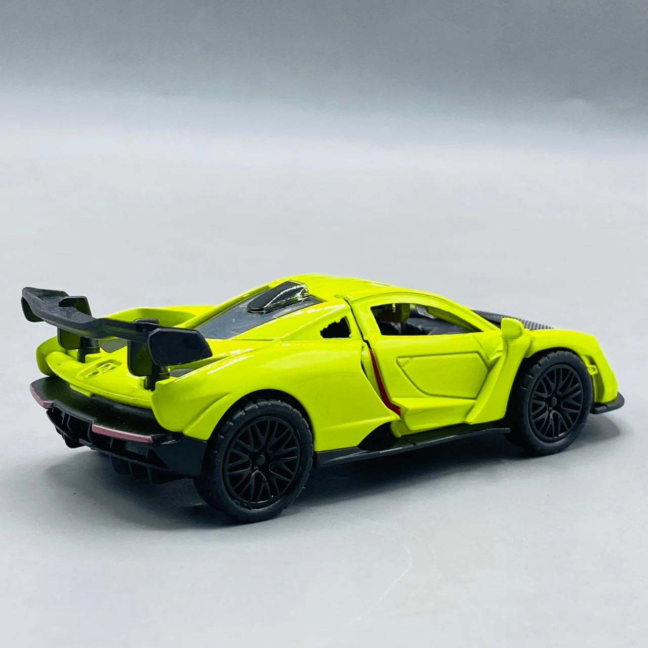 Yellow sports car model on a gray background