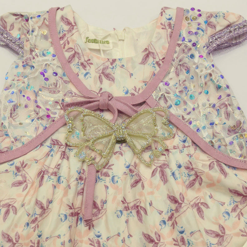Floral dress with decorative bow.