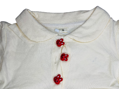 White shirt with red buttons on a white background