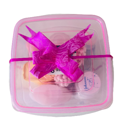 Pink dragon toy in a clear container with pink trim on a white background