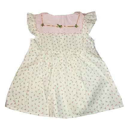 White dress with floral pattern on a white background