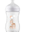 Clear baby bottle with a white cap and giraffe design on a white background