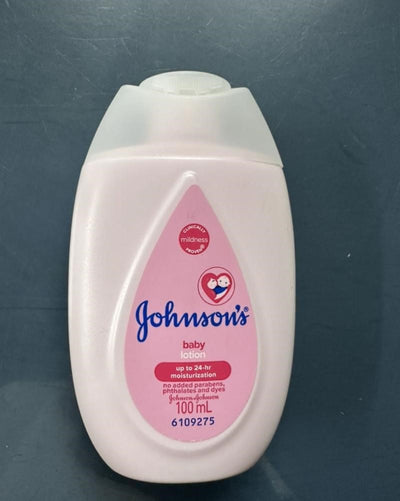 Johnson's baby lotion bottle on a dark background