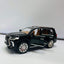  A black diecast model of a Lexus LX570 SUV, viewed from the front three-quarter angle on a white background.
