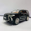  A black diecast model of a Lexus LX570 SUV, viewed from the front three-quarter angle.