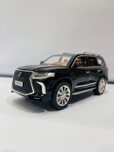  A black diecast model of a Lexus LX570 SUV, viewed from the front three-quarter angle.