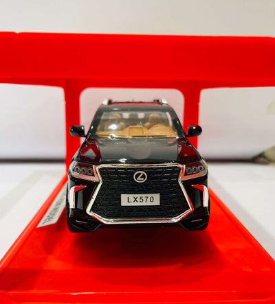  A black diecast model of a Lexus LX570 SUV, viewed from the front Two-quarter angle.