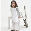 Child wearing a white traditional outfit with floral patterns