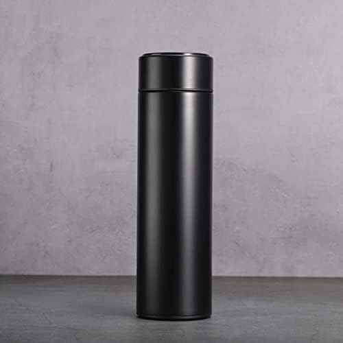 Black thermos bottle on a gray concrete background