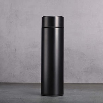 Black thermos bottle on a gray concrete background