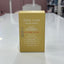 Gold box labeled 'Baby Love' on a white surface with a blurred background