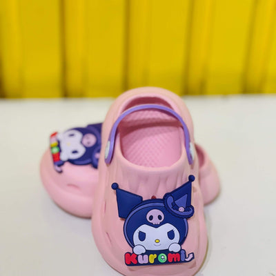 Pink children's clogs with cartoon character design on a yellow background