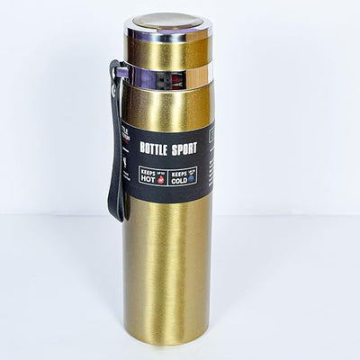 Gold insulated bottle with black label on a white background