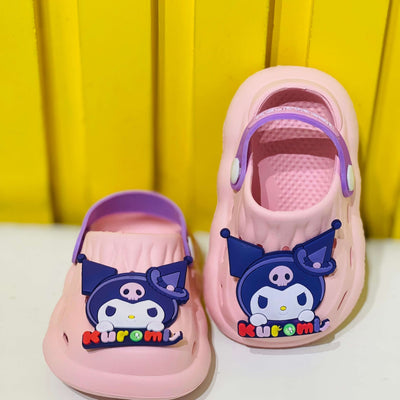 Pink clogs with cartoon character design on a yellow background
