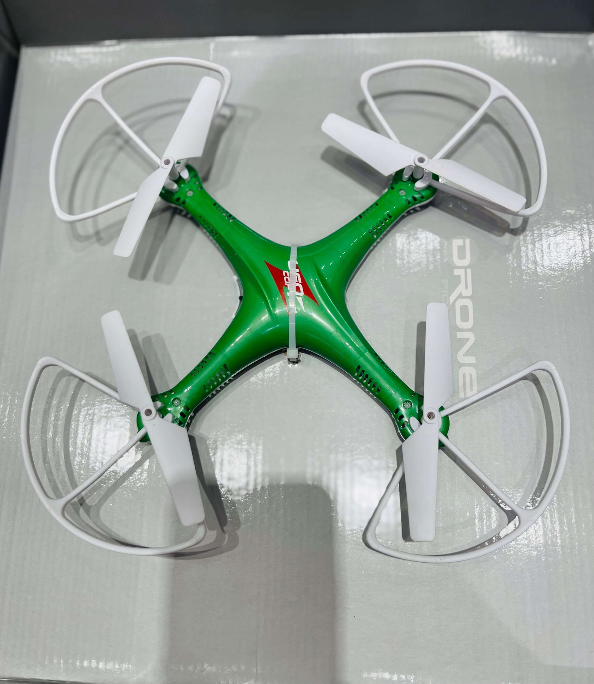 Green drone with white propellers 