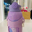 Purple water bottle with a cartoon design on a white surface