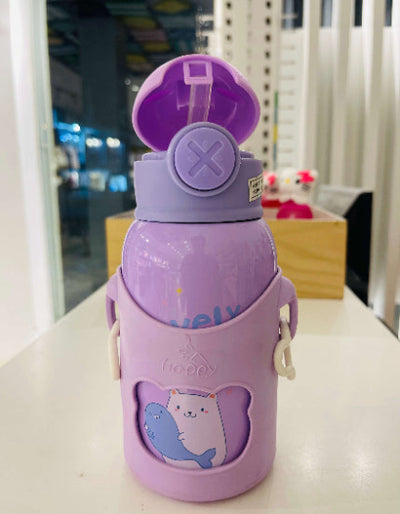 Purple water bottle with cartoon design on a white surface