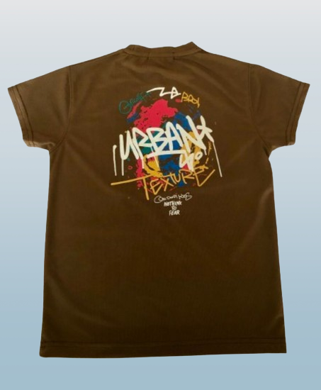 Brown t-shirt with colorful graphic design on a light blue background