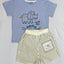 Children's outfit with blue t-shirt and striped shorts.