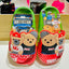 Children's shoes with cartoon bear design on a white background