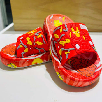 Red children's sandals with cartoon characters on a white surface.