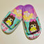Colorful children's slippers with cartoon character design on a white background
