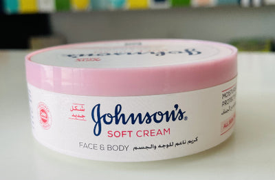 Johnson's Soft Cream jar on a white surface with a colorful background