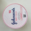 Johnson's Soft Cream container with pink lid on a light gray background