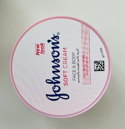 Johnson's Soft Cream container with pink lid on a light gray background