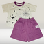 Children's outfit with a t-shirt and purple shorts on a white background