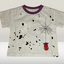 Children's t-shirt with spider-themed design on a plain background