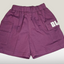 Purple shorts with a logo on a white background