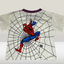 T-shirt with Spider-Man graphic on a white background