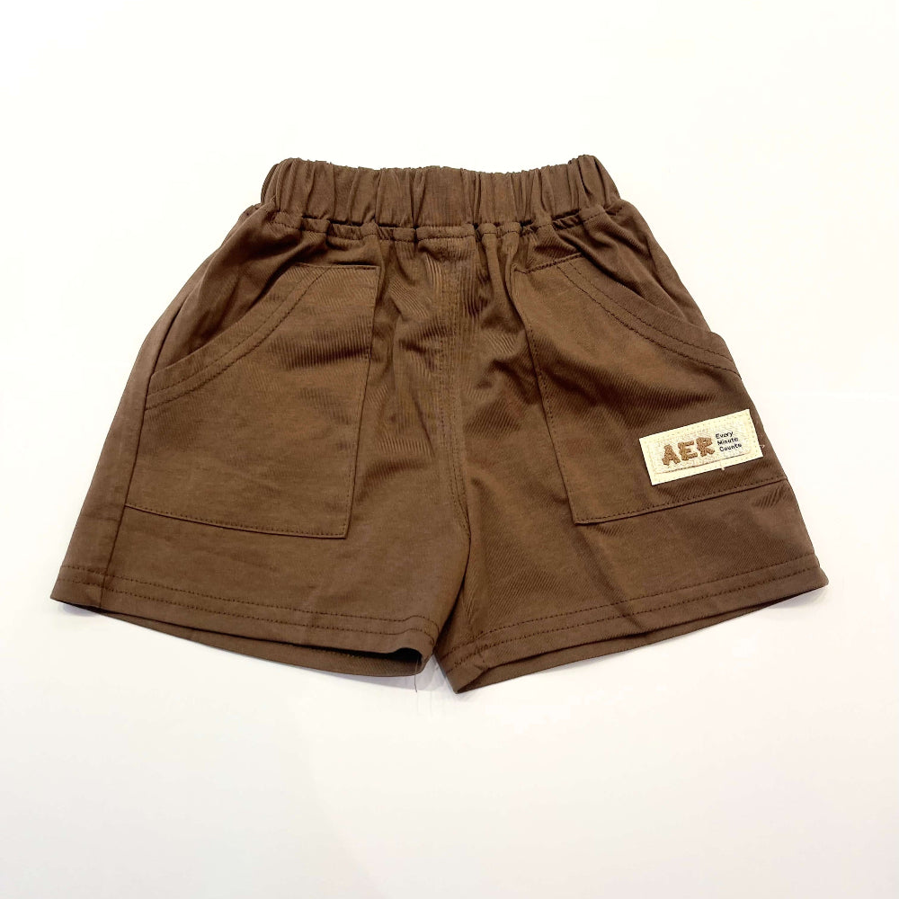 Brown shorts with a visible brand label.