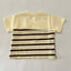 Beige t-shirt with brown and beige striped pattern on a gray background