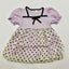 Lavender dress with black polka dots on a white background