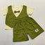 Children's green outfit with vest, shorts, and bow tie.