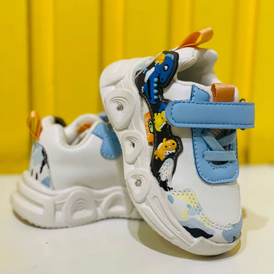 Children's sneakers with cartoon design on a yellow background