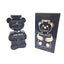 Black bear-shaped perfume bottle with packaging labeled 'Baby Bear' on a white background