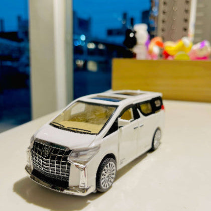 Model toy car on a reflective surface with a blurred background