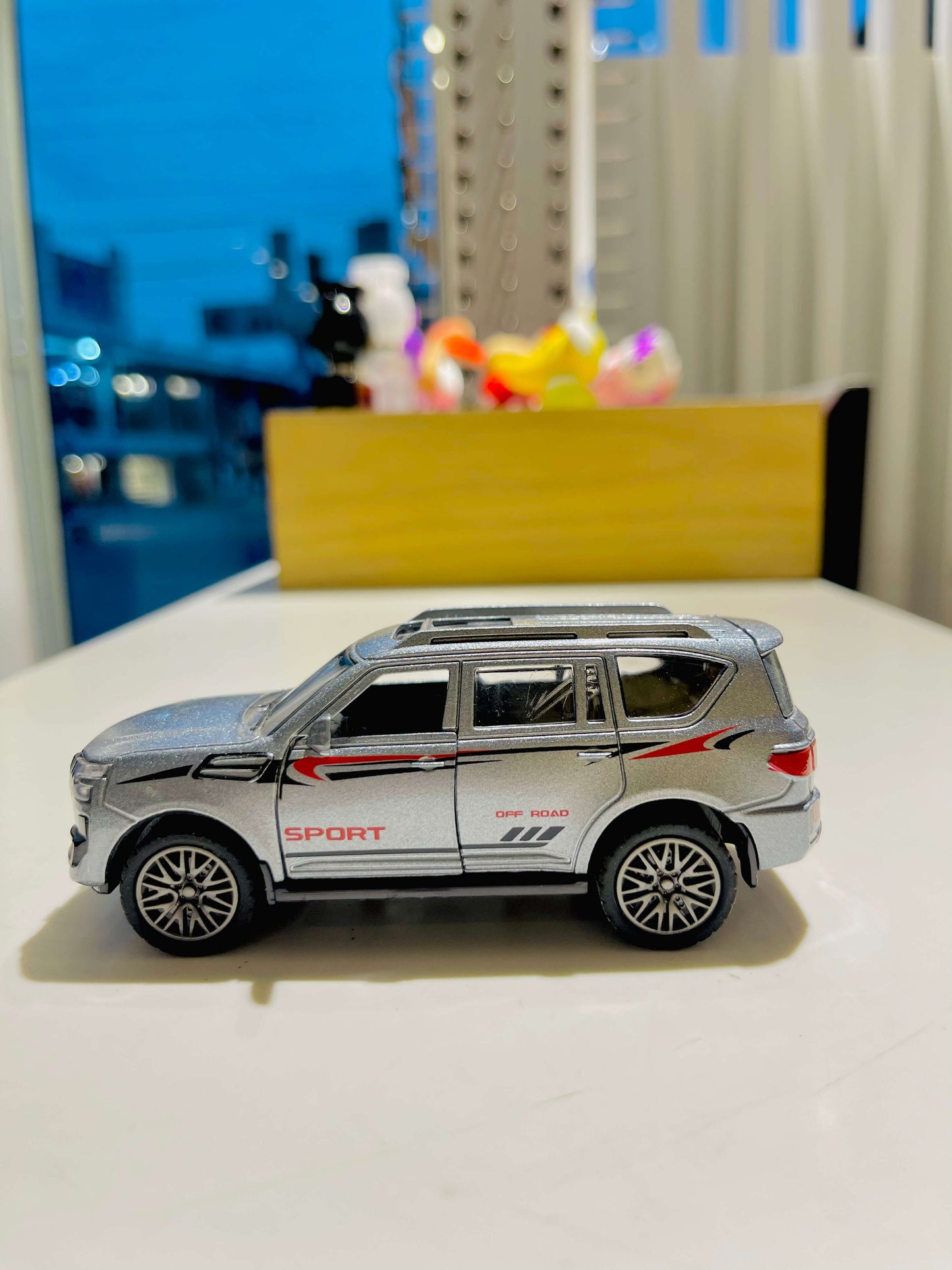 Model SUV on a surface with a blurred background