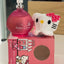 Pink 'Baby Love' perfume bottle with Hello Kitty design on packaging and plush toy.